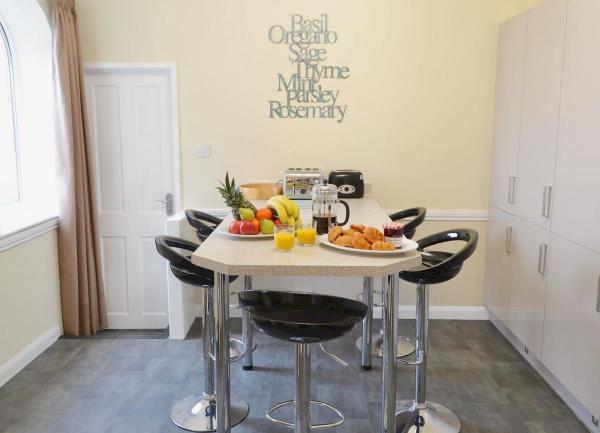 A table laid for breakfast with stools for seating.