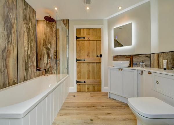 Bathroom with bath/shower WC and washbasin.
