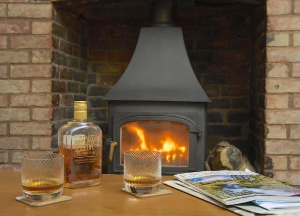 Inglenook fireplace with woodburner.