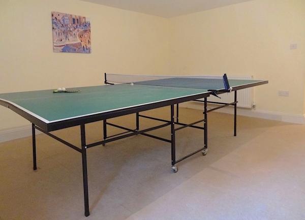 Games room with table tennis table.
