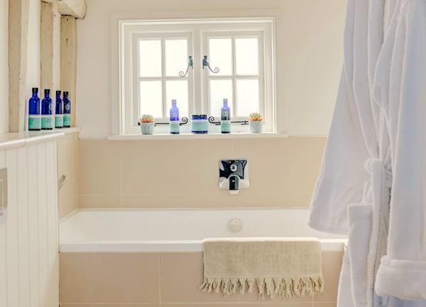 Bathroom with bath and heated towel rail.