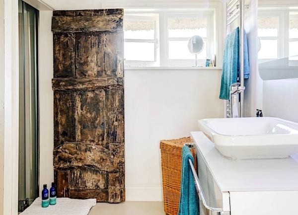 Bathroom with contemporary basin and heated towel rail.