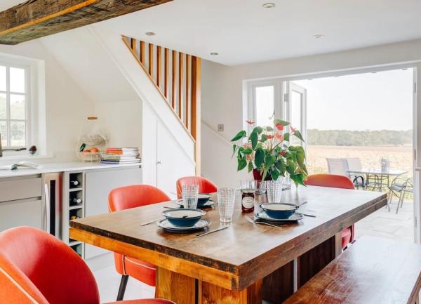 Dining area with table, 4-chairs and a bench.