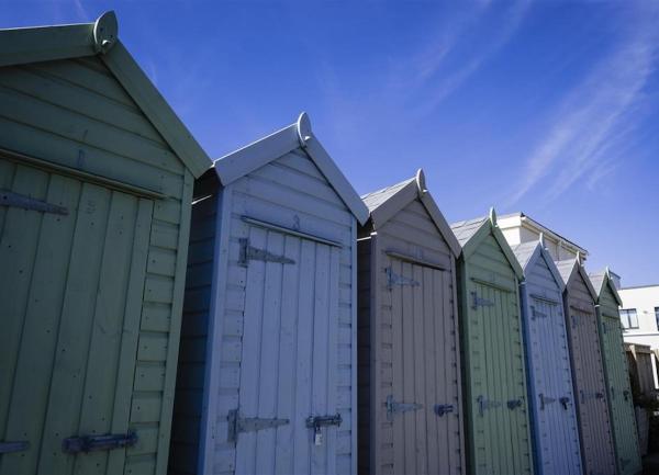 A row of huts for storming beach gear.