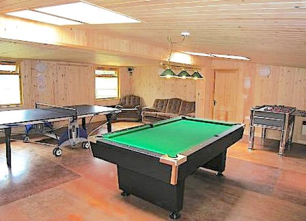Games room with pool, table tennis and football tables.