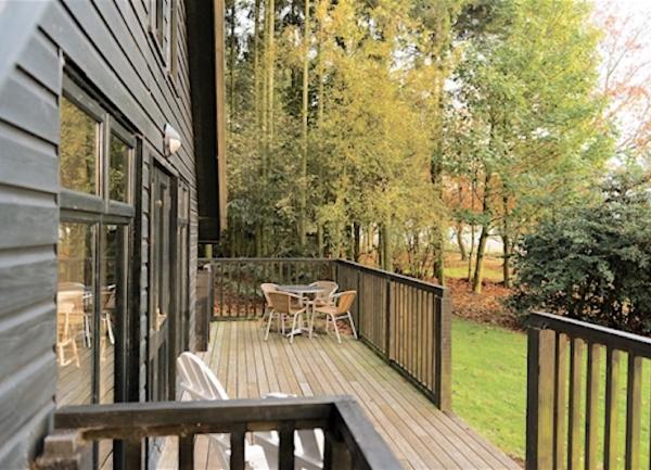Garden deck with dining table and seating.