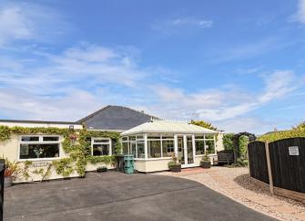 Seaside Bungalow wit conservatory and large parking area.