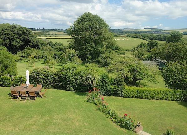 Garden picnic spot with rural views.