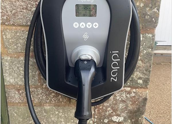 Wall-mounted electric vehicle charger.