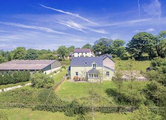 Aerial view of the cottage and gardens surrounding it.
