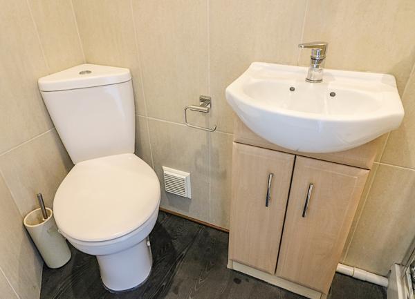 Bathroom washbasin and toilet.