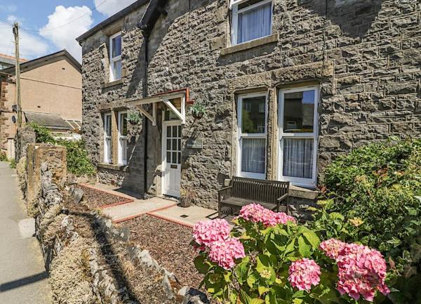 Front exterior of a stone-built house.