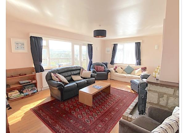 Lounge with sofas, armchairs and coffee table.
