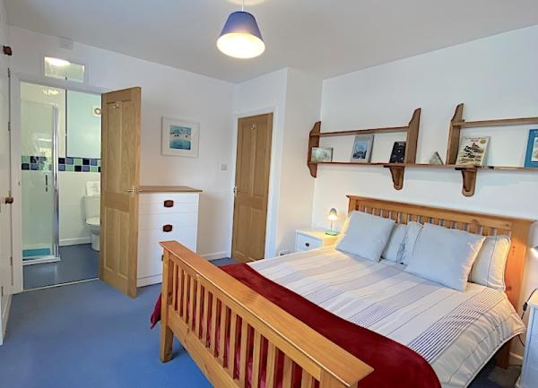 Double bedroom with chest of drawers and ensuite.