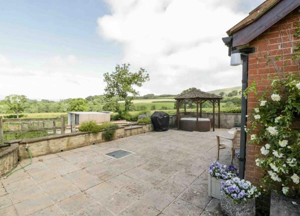 Courtyard with hot tub shelter.