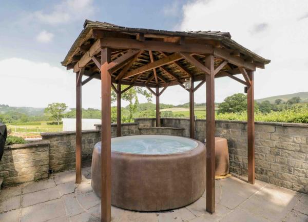Hot tub on the terrace with rural views.