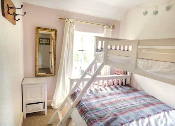 Bedroom with one single and 1 double bunk bed set.