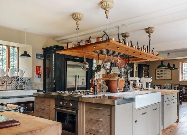 Luxury fitted kitchen including an /Islland block with a range cooker.