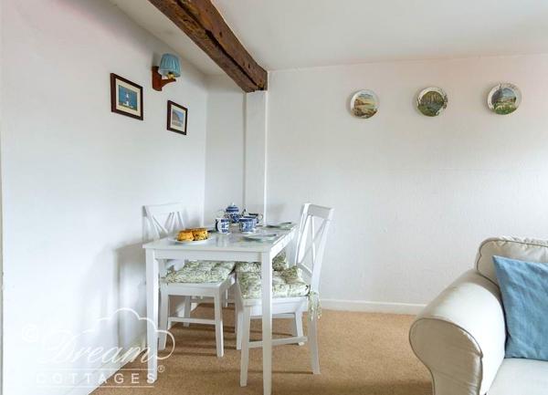 Dining table for two laid for tea.