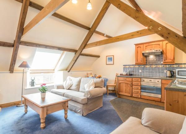 Open-plan kitchen and lounge areas.