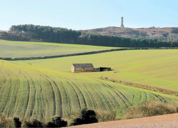 Rolling fields with a remote stone barn conversion in their midst