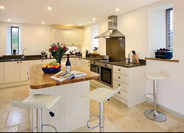 A dual aspect luxury fitted kitchen wit integrated appliances.