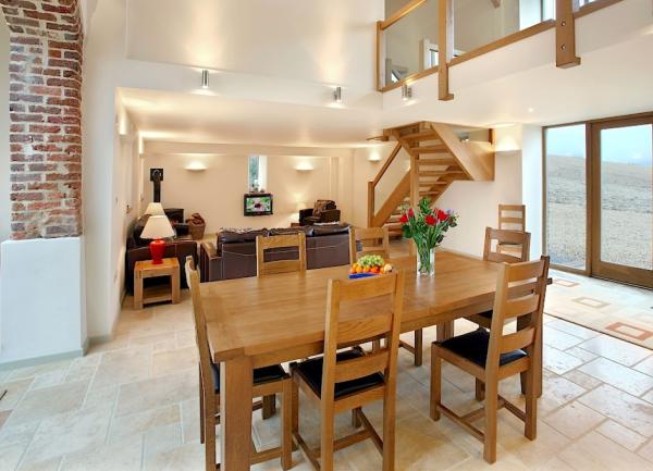 A dining area with table and 6 chairs.