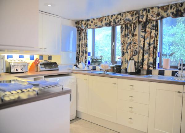 Fitted kitchen units with oven and worktop appliances.