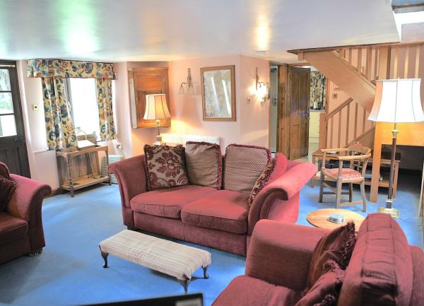 Lounge with 2 sofas and armchair. 