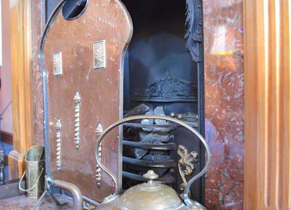 Aatique fireplace, copper kettle and fire-quard.