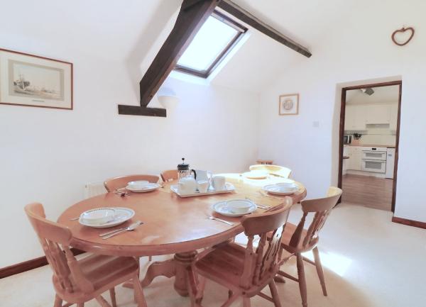 A dining table laid for breakfast.
