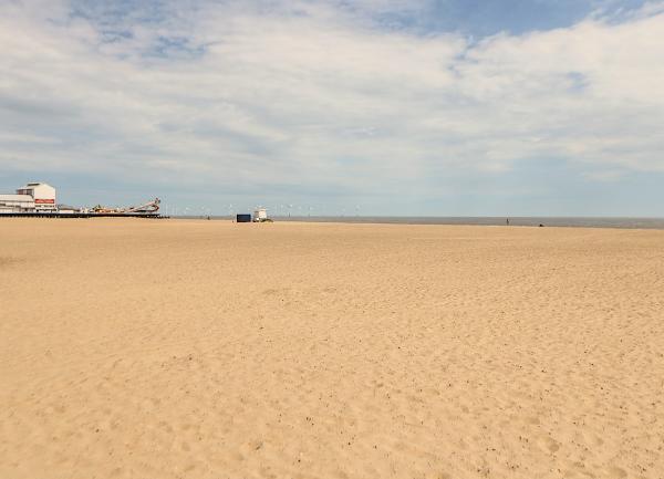 Great Yarmouth's long flat sandy beach at low tide.