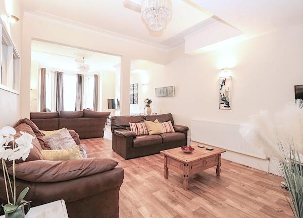 2 lounge areas in an open plan room.