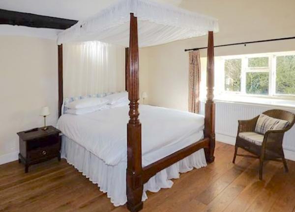 Bedroom with a 4-poster double bed.