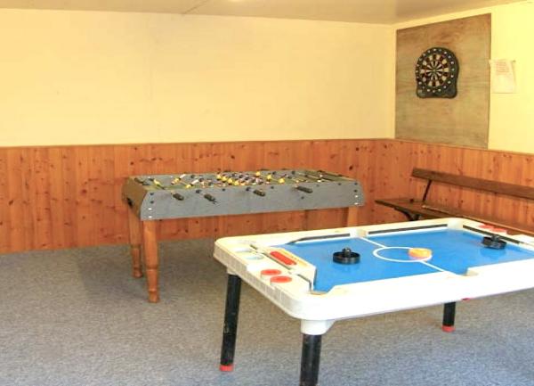 Games room with table football, air-hockey and dartboard.