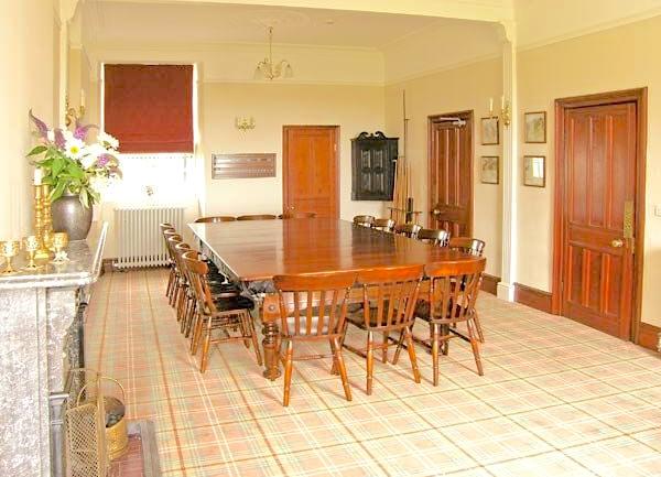 Dining Room with a large oak table with 16 chairs.