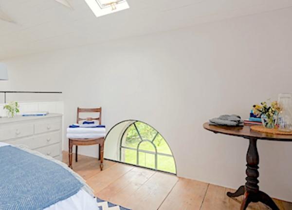   Double bedroom with a bed and chest of drawers.