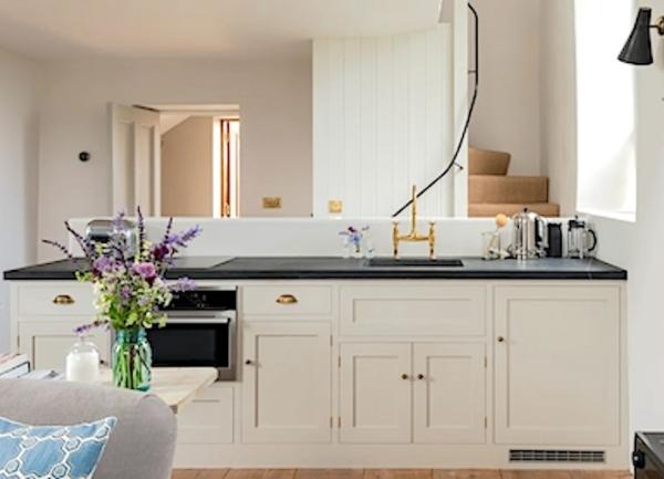 Kitchen unit with a sink and integrated oven.
