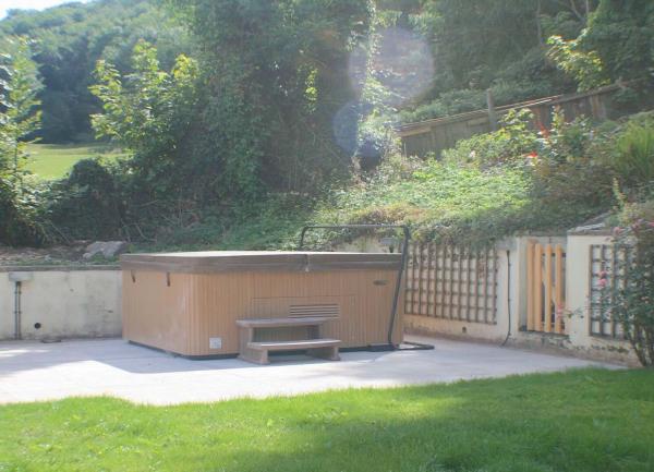 A hot tub in the rear garden.