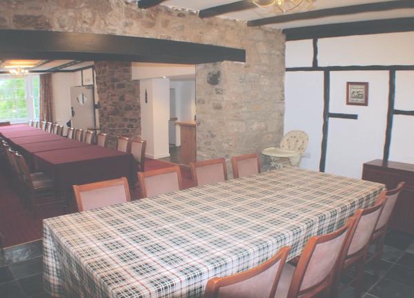 Dining room with two tables and forty chairs.