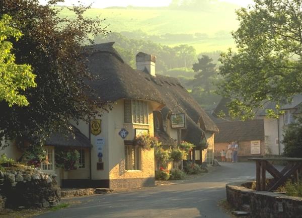 Thatched cottages and a pub in the Exmoor village of Winsford.