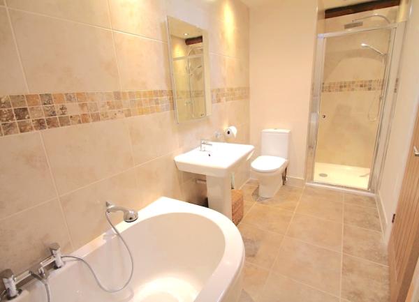 Bathroom with  bath, washbasin, WC and shower cubicle.
