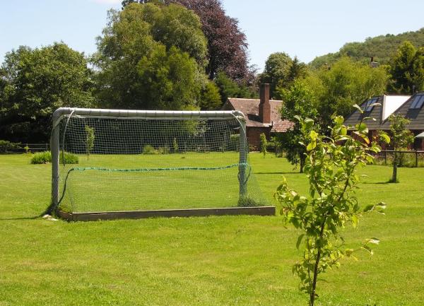 A football field with a goal and net.