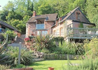 Large, 3-storey coastal holiday cottage surrounded by gardens in Porlock Weir