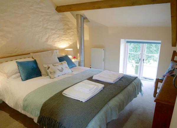 A double bedroom with a double bedroom with rural views.
