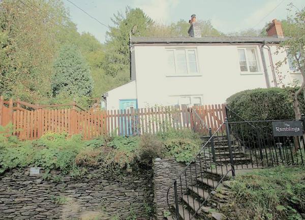 Exterior of a Dulverton holiday cottage with steps to the garden gate.