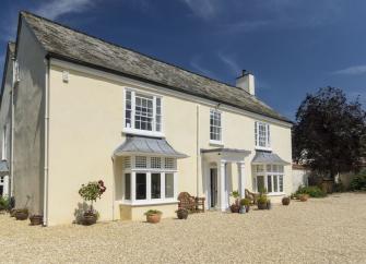 View interior and exterior photos of Abbots Manor, a large East Devon holiday cottage in Combe Raleigh.