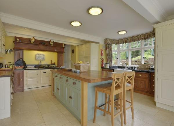 Kitchen with a 3-ring Aga in an inglenook.