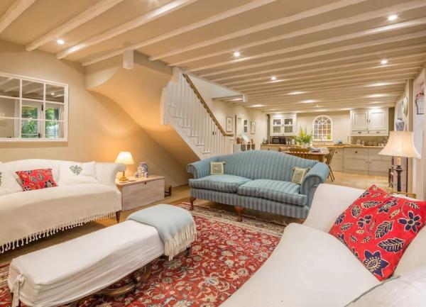 Oak-beamed, open plan lounge, dining and kitchen areas.
