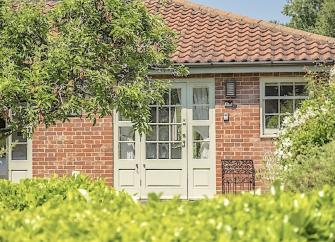 A Luxury Cotswold Farm Barn Conversion within a walled garden.